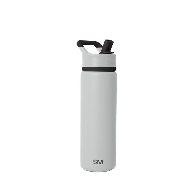 Pale gray matte insulated water bottle with cylindrical shape on light gray background Pale gray matte insulated water bottle with cylindrical shape on light gray background