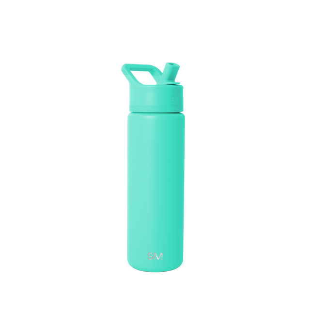 Bright turquoise seafoam green bottle against clean white background Bright turquoise seafoam green bottle against clean white background