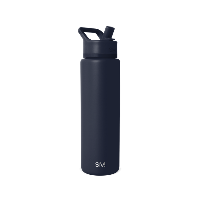 Deep navy blue skincare bottle with pump dispenser on white background Deep navy blue skincare bottle with pump dispenser on white background