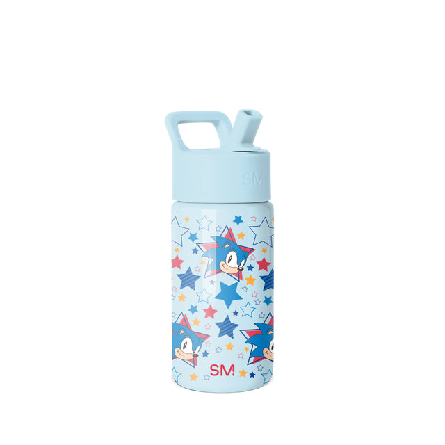 Simple Modern water bottle with pale blue lid and handle, white body featuring Sonic the Hedgehog character design in red, navy, gold, and coral accents, SM logo visible, studio product shot on white background. Simple Modern water bottle with pale blue lid and handle, white body featuring Sonic the Hedgehog character design in red, navy, gold, and coral accents, SM logo visible, studio product shot on white background.