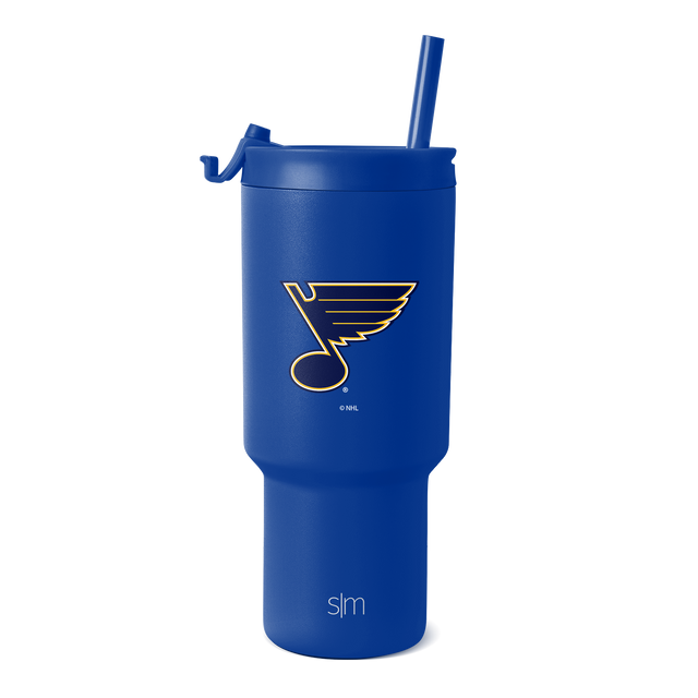 Bright royal blue tumbler with glossy finish, featuring St. Louis Blues team logo and SM branding in gold and cream. Bright royal blue tumbler with glossy finish, featuring St. Louis Blues team logo and SM branding in gold and cream.