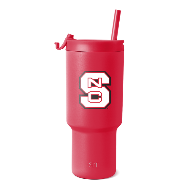 Hot pink stainless steel tumbler with matching integrated straw and logo branding on lower section Hot pink stainless steel tumbler with matching integrated straw and logo branding on lower section