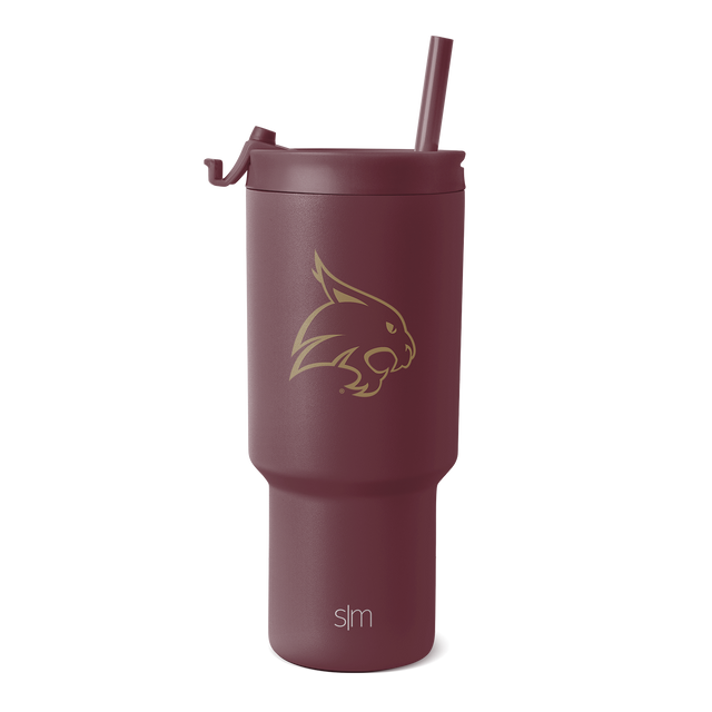 Deep burgundy drinkware with gold metallic accents on logo and branding details Deep burgundy drinkware with gold metallic accents on logo and branding details