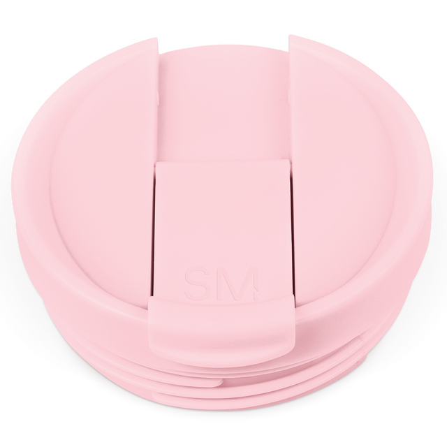 Pale pink flip-top plastic lid with raised rectangular tab closure, photographed against white background Pale pink flip-top plastic lid with raised rectangular tab closure, photographed against white background