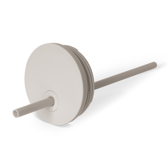 Beige and gray striped track lighting lid with circular disc accent detail in neutral taupe tones Beige and gray striped track lighting lid with circular disc accent detail in neutral taupe tones