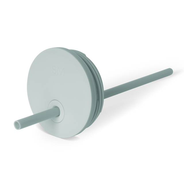 Soft sage green circular lid with cylindrical straw housing and neutral teal accents, suitable for beverages and daily use. Soft sage green circular lid with cylindrical straw housing and neutral teal accents, suitable for beverages and daily use.