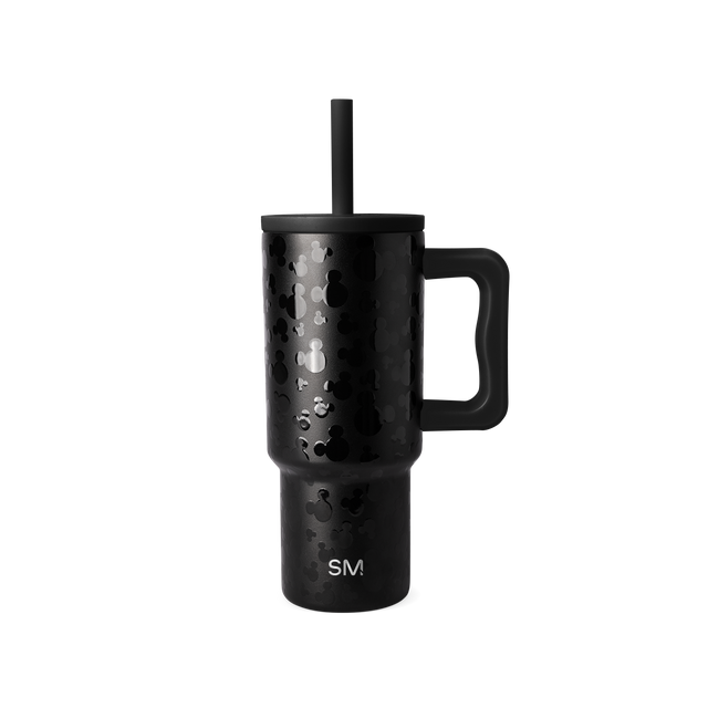Black insulated tumbler with matte finish and white speckled texture pattern on white background Black insulated tumbler with matte finish and white speckled texture pattern on white background
