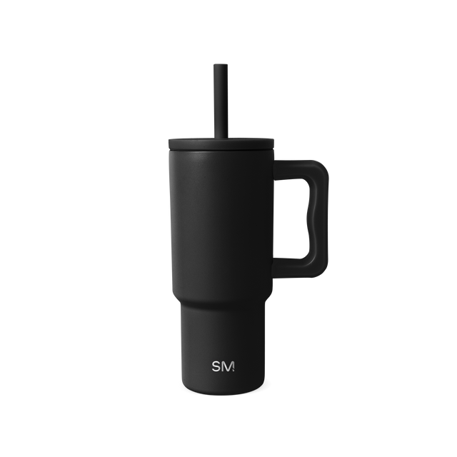 Matte black vessel against neutral off-white background Matte black vessel against neutral off-white background