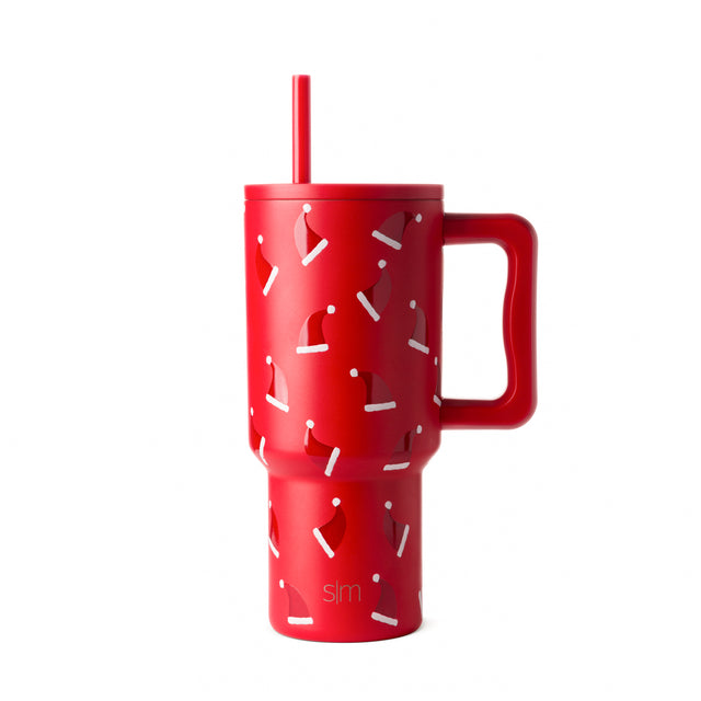 Red insulated tumbler with white and gray decorative pattern, featuring a handle, displayed against off-white background Red insulated tumbler with white and gray decorative pattern, featuring a handle, displayed against off-white background