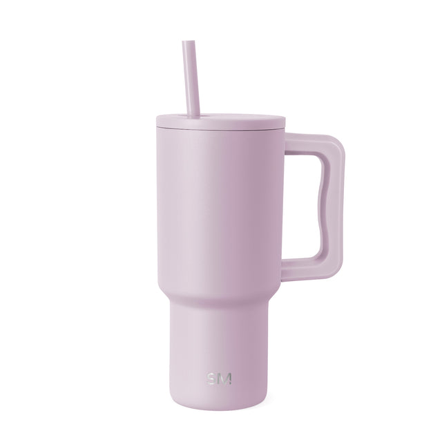 Mauve pink insulated tumbler with handle and matching straw on white background. Simple Modern logo visible on lower front. Modern cylindrical design with fitted lid. Mauve pink insulated tumbler with handle and matching straw on white background. Simple Modern logo visible on lower front. Modern cylindrical design with fitted lid.