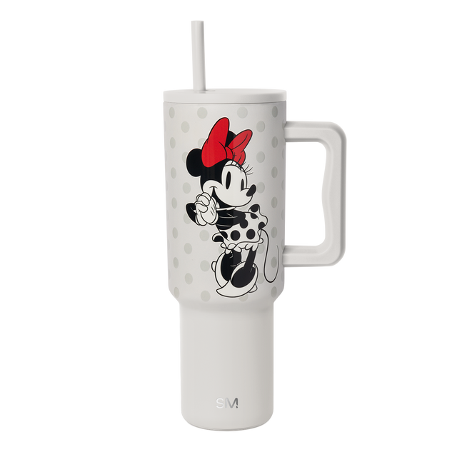 Cream-colored cylindrical tumbler with soft gray polka dots on upper portion, white and light gray background Cream-colored cylindrical tumbler with soft gray polka dots on upper portion, white and light gray background