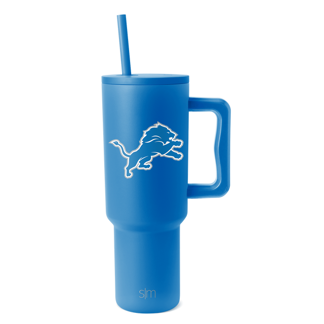 Bright blue tumbler with white logo and branding details on neutral white background Bright blue tumbler with white logo and branding details on neutral white background