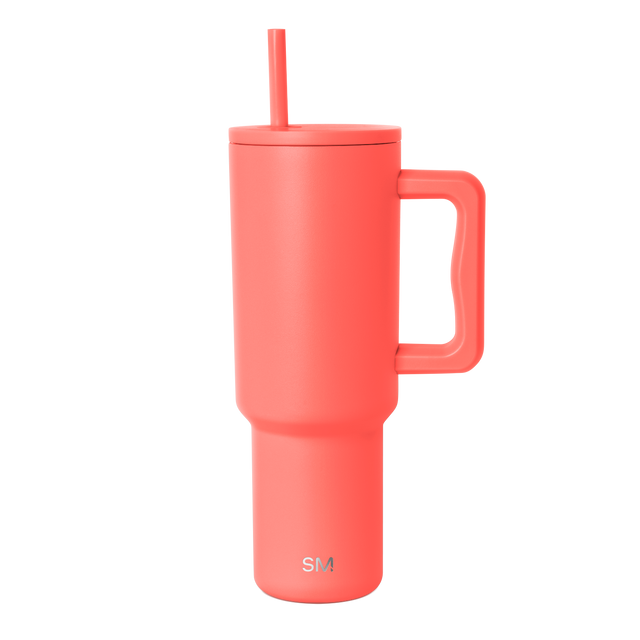Coral-red tumbler with white background Coral-red tumbler with white background