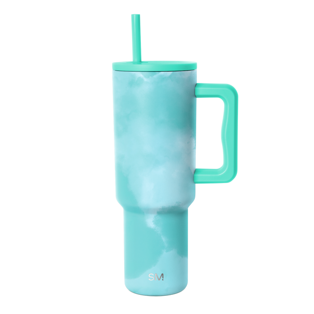 Turquoise tie-dye tumbler with matching handle and lid, featuring a cloudy blue-green ombre pattern throughout the body Turquoise tie-dye tumbler with matching handle and lid, featuring a cloudy blue-green ombre pattern throughout the body