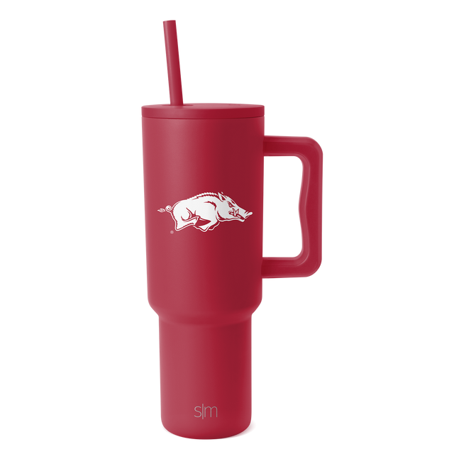 Ruby red tumbler with handle, matching lid and straw, cylindrical design with deep burgundy tone throughout. Ruby red tumbler with handle, matching lid and straw, cylindrical design with deep burgundy tone throughout.
