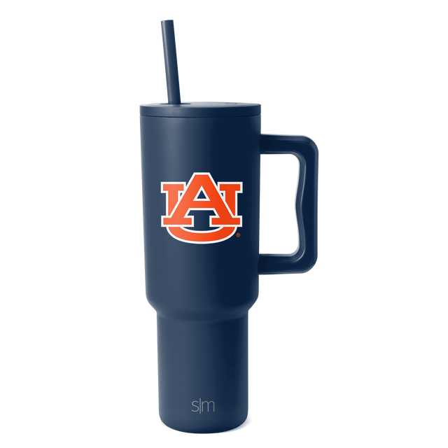 Deep navy blue tumbler with university logo featuring bright orange and white accents on clean background Deep navy blue tumbler with university logo featuring bright orange and white accents on clean background