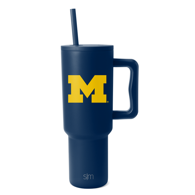 Deep navy blue tumbler with bright yellow University of Michigan logo, matching navy blue straw included. Deep navy blue tumbler with bright yellow University of Michigan logo, matching navy blue straw included.