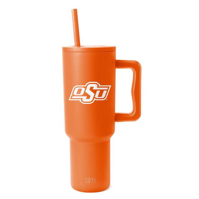 Bright orange tumbler with matching lid, handle, and straw on white background Bright orange tumbler with matching lid, handle, and straw on white background