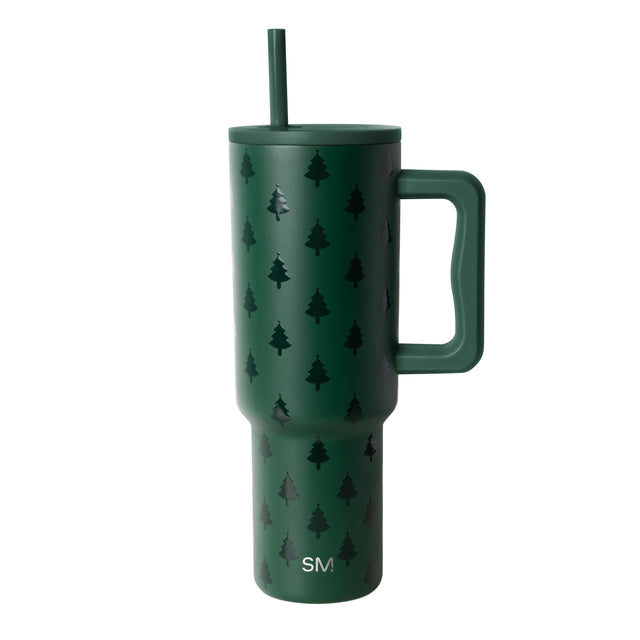 Forest green tumbler with black tree silhouettes, matching lid, handle, and straw Forest green tumbler with black tree silhouettes, matching lid, handle, and straw