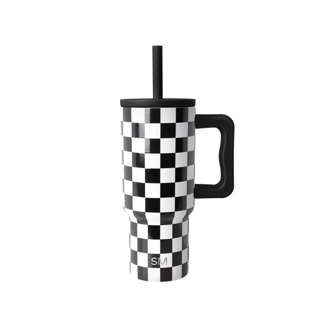 Black and white checkerboard travel tumbler with black handle, lid, and straw. Simple Modern logo visible on front. Studio product photo on white background. Black and white checkerboard travel tumbler with black handle, lid, and straw. Simple Modern logo visible on front. Studio product photo on white background.