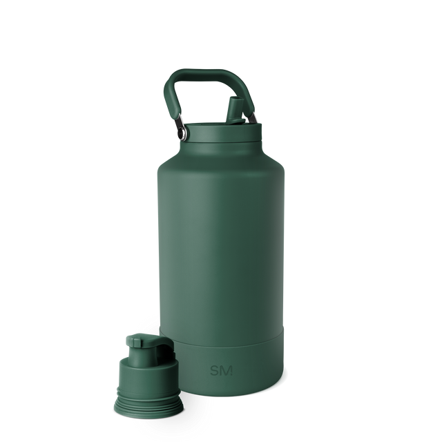 Deep forest green water bottle with matching handle, spout cap, and base against a neutral background. Deep forest green water bottle with matching handle, spout cap, and base against a neutral background.