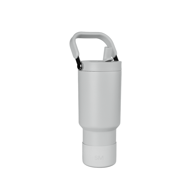Pale gray cylindrical insulated drinkware vessel with streamlined modern design and minimalist proportions. Pale gray cylindrical insulated drinkware vessel with streamlined modern design and minimalist proportions.