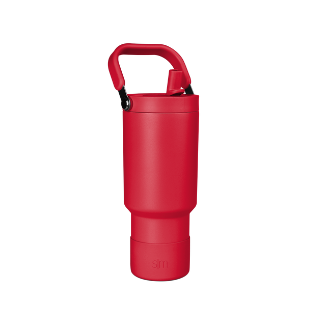 Red insulated tumbler with handle, 30 ounces, cylindrical design with tapered base on white background Red insulated tumbler with handle, 30 ounces, cylindrical design with tapered base on white background