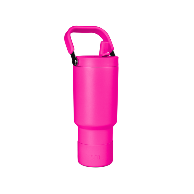 Vibrant hot pink cylindrical vessel with matching handle against white background Vibrant hot pink cylindrical vessel with matching handle against white background