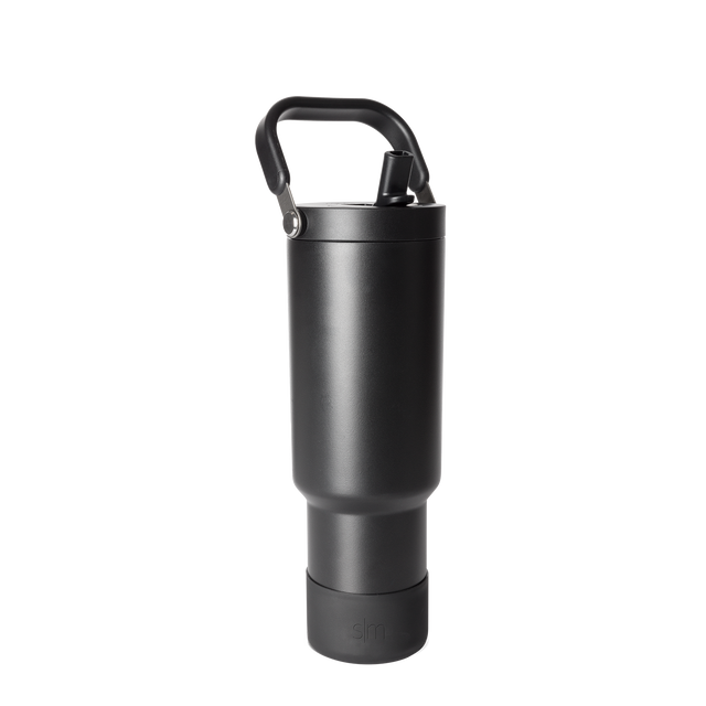 Black matte finish bottle with metallic gray accents, handle, and base against dark gray background Black matte finish bottle with metallic gray accents, handle, and base against dark gray background