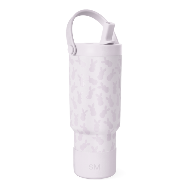 Pale lavender bottle with darker mauve camouflage pattern, featuring a handle and top rim detail. Pale lavender bottle with darker mauve camouflage pattern, featuring a handle and top rim detail.