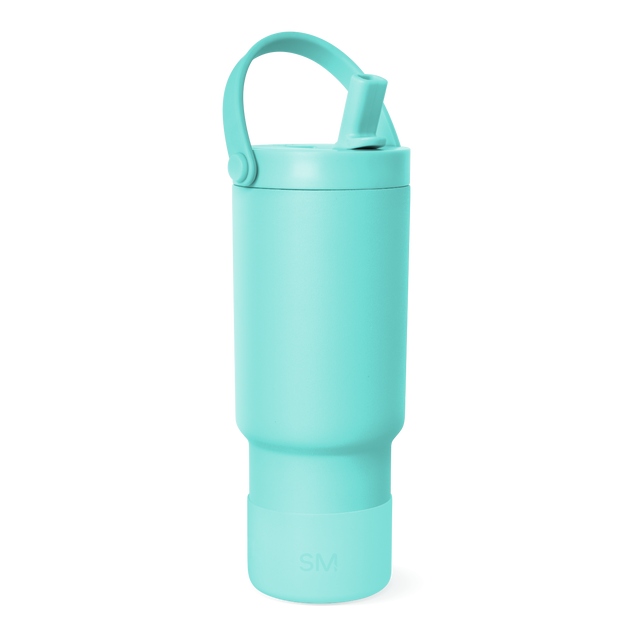 Pale turquoise water bottle displayed against white background Pale turquoise water bottle displayed against white background