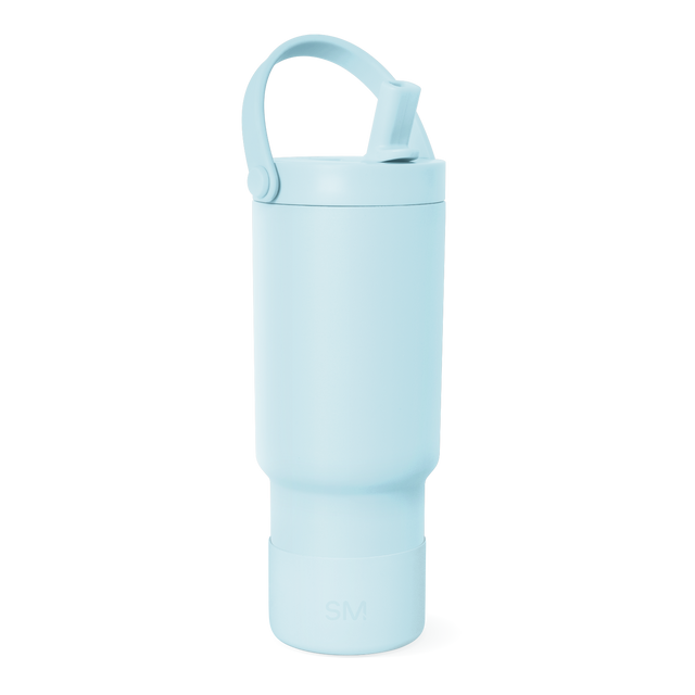 Light blue cylindrical water bottle with soft sky blue color against white background Light blue cylindrical water bottle with soft sky blue color against white background
