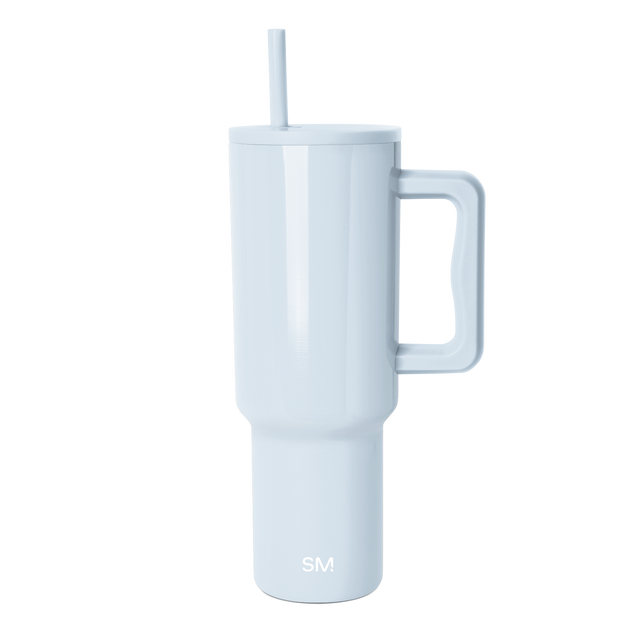 Light blue powder-colored tumbler with tapered cylindrical shape widening toward the top, displayed against a plain background. Light blue powder-colored tumbler with tapered cylindrical shape widening toward the top, displayed against a plain background.