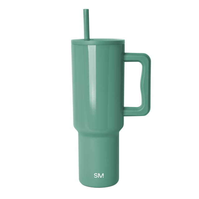 Sage green semi-gloss tumbler with smooth cylindrical body and subtle light reflections Sage green semi-gloss tumbler with smooth cylindrical body and subtle light reflections