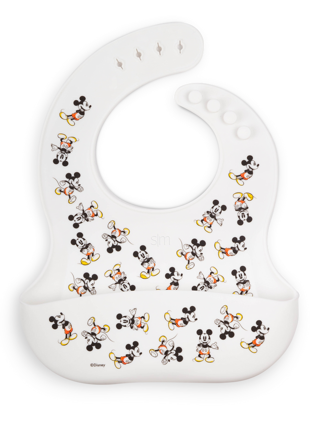 White bib with Mickey Mouse characters featuring black bodies and yellow and orange accents on shorts White bib with Mickey Mouse characters featuring black bodies and yellow and orange accents on shorts