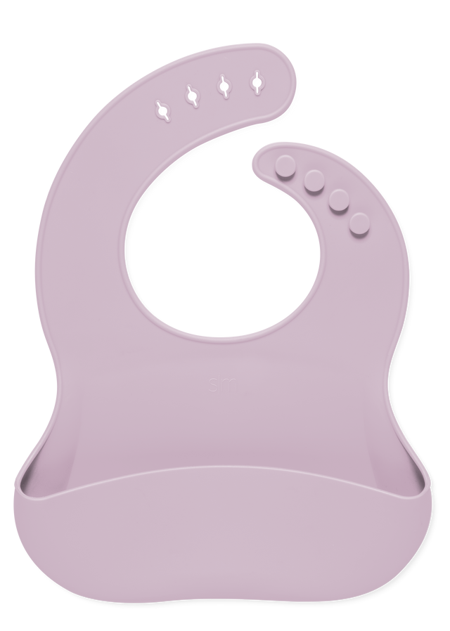 Soft mauve pink baby bib on white background Soft mauve pink baby bib on white background