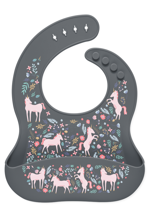 Dark gray baby bib with pink unicorns, teals and greens foliage, and coral and hot pink flowers design Dark gray baby bib with pink unicorns, teals and greens foliage, and coral and hot pink flowers design