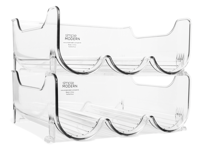 Two-pack of clear acrylic bottle organizers with tiered wave design and black trim, featuring three curved compartments each, handles on upper walls, displayed against white background with Simple Modern branding visible. Two-pack of clear acrylic bottle organizers with tiered wave design and black trim, featuring three curved compartments each, handles on upper walls, displayed against white background with Simple Modern branding visible.