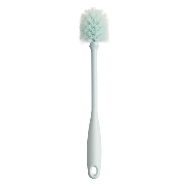 Sage green cleaning brush with soft bristles and matching handle on white background Sage green cleaning brush with soft bristles and matching handle on white background