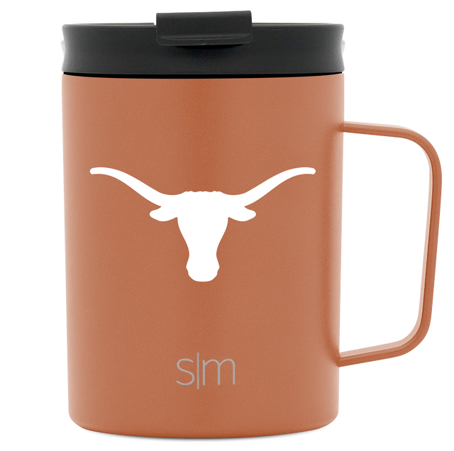 Stainless steel insulated coffee mug with handle in terracotta orange color on white background Stainless steel insulated coffee mug with handle in terracotta orange color on white background