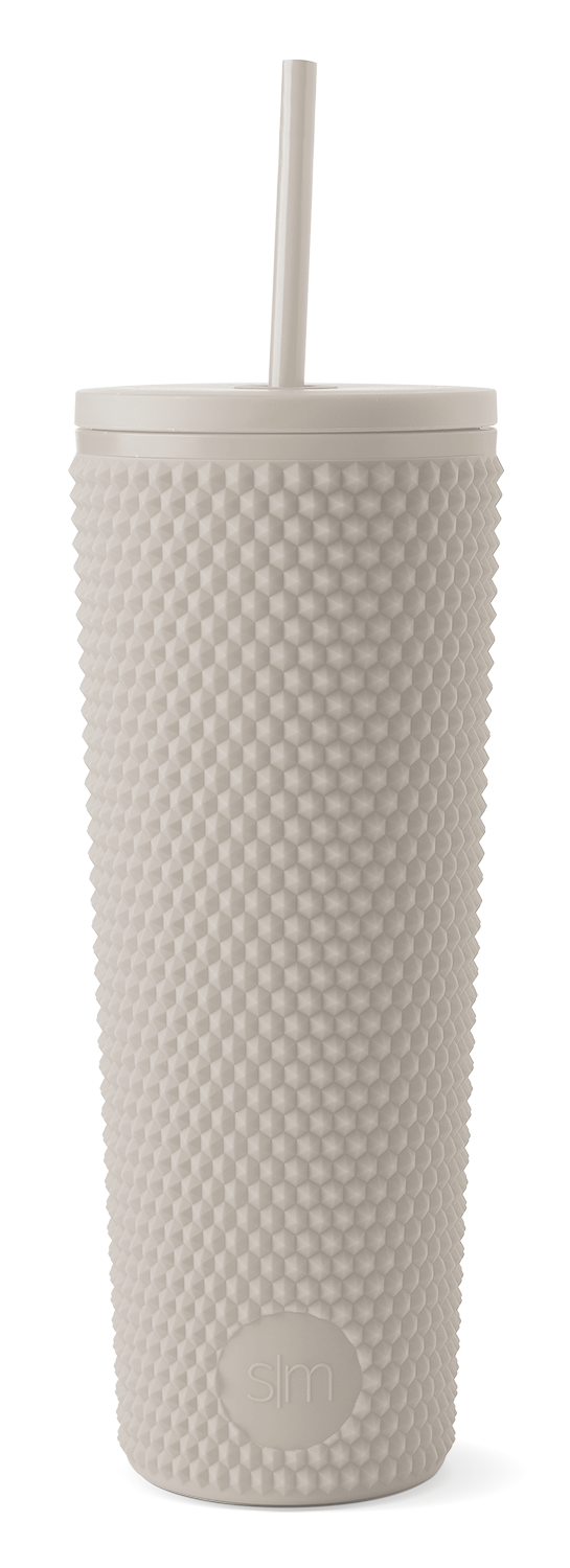 Cream-colored textured tumbler with modern design on white background Cream-colored textured tumbler with modern design on white background