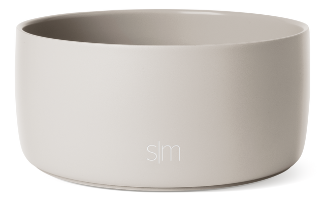 Soft cream-colored ceramic vessel with light gray-beige interior, neutral tones throughout Soft cream-colored ceramic vessel with light gray-beige interior, neutral tones throughout