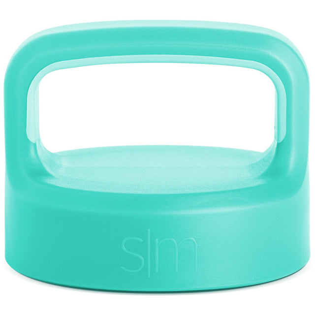 Soft turquoise mint green product lid with handle on white background Soft turquoise mint green product lid with handle on white background