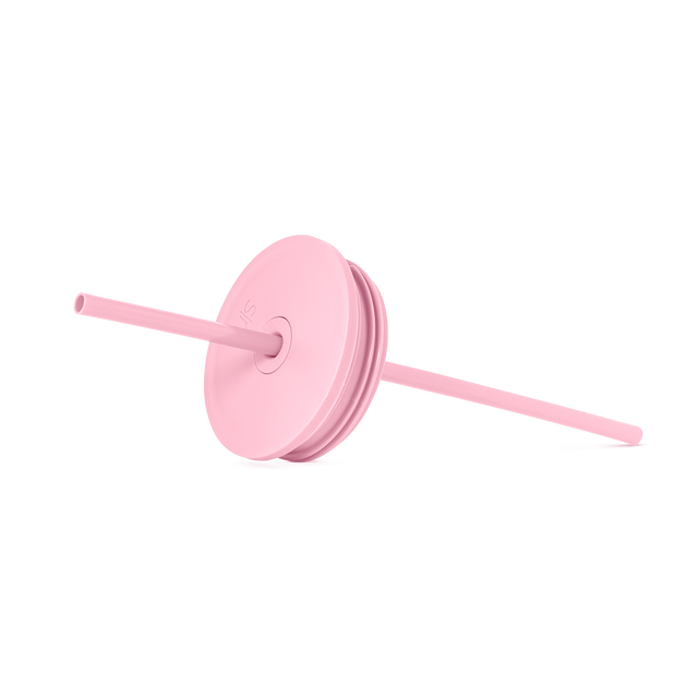 Pale pink silicone lid and straw against light gray background Pale pink silicone lid and straw against light gray background