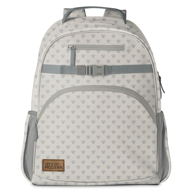 Cream and gray backpack with mesh accents, gray repeating pattern, padded straps, and metal zipper hardware