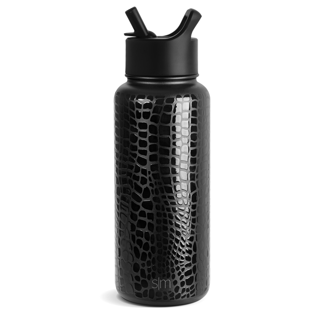 Black matte finish bottle with embossed pattern and gray highlights against a dark background