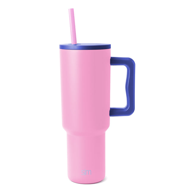 Pink and navy tumbler with lid and rim, cylindrical design with color-block style