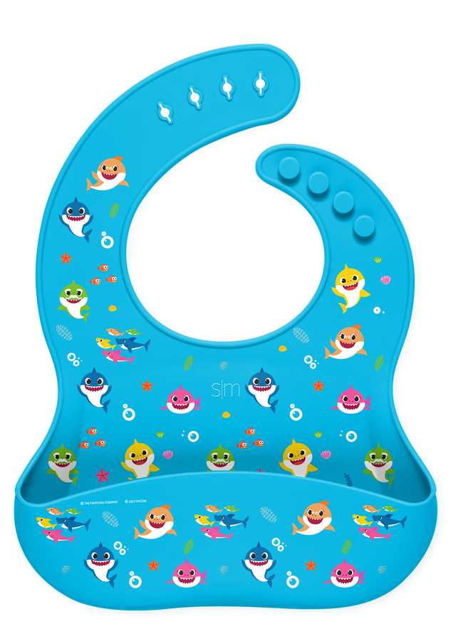 Colorful product design featuring vibrant turquoise background with illustrated shark in yellow, pink, orange, red, and green accents with white details.