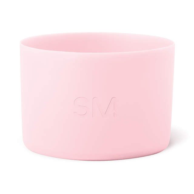 Soft pale pink cylindrical container with smooth sides and open rim, minimalist design