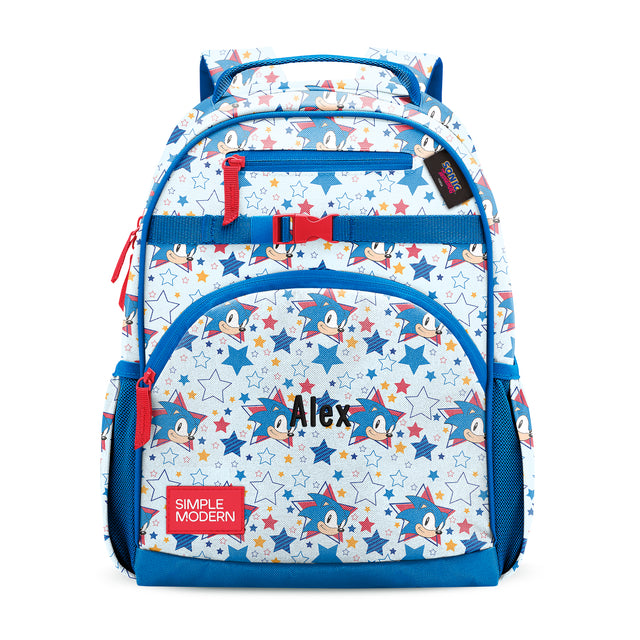 Children's backpack with blue frame, cream body, and red accents featuring Mickey Mouse cartoon characters and colorful stars. Front compartments with 